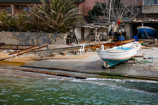 The place where small boats are launched into the sea is typically a marina, harbor, or beach