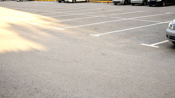 istock Car parking with white markings on the asphalt, close-up 2050550034