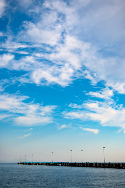 Sky for background, sky and clouds. Bright blue sky and light of the sun. Beautiful sky with cloud before sunset and harbor