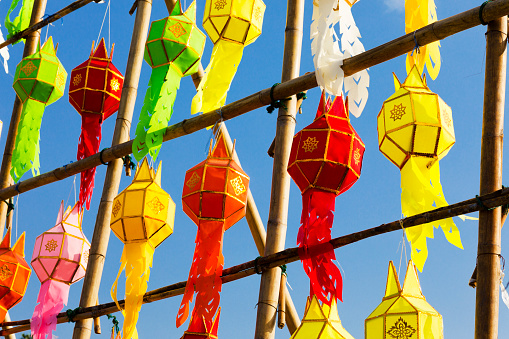 Bamboo grid with thai paper lanterns in clear sky for festival in  Lampang