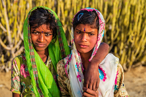 Two Gypsy Indian girls in desert village, Thar Desert, Rajasthan, India.