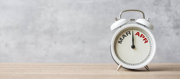 istock Hello April Changed from March month with vintage alarm clock on table background. Calendar, Monthly, New Start, Resolution, Goals, Plan, Action and Mission Concept 2050592398