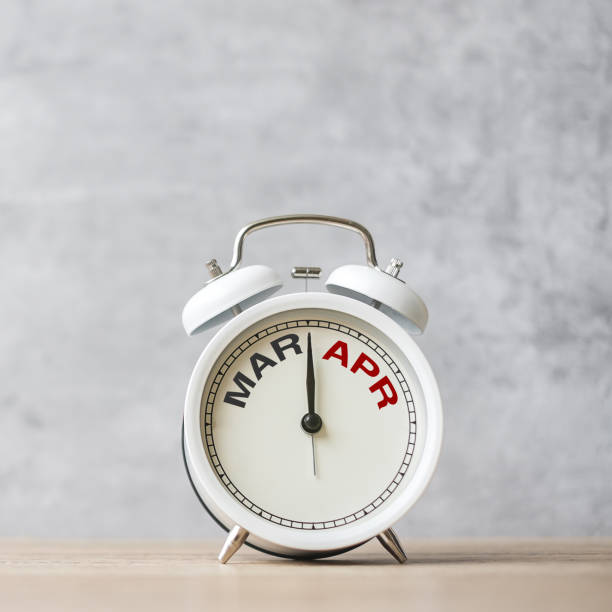 istock Hello April Changed from March month with vintage alarm clock on table background. Calendar, Monthly, New Start, Resolution, Goals, Plan, Action and Mission Concept 2050592400