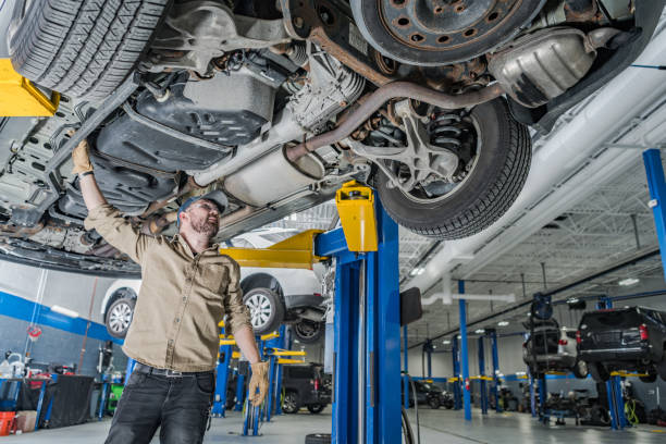 istock Professional Mechanic Checking Vehicle Undercarriage 2050599760