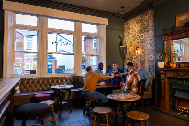 istock Men Raising Glasses in a Pub 2050607863