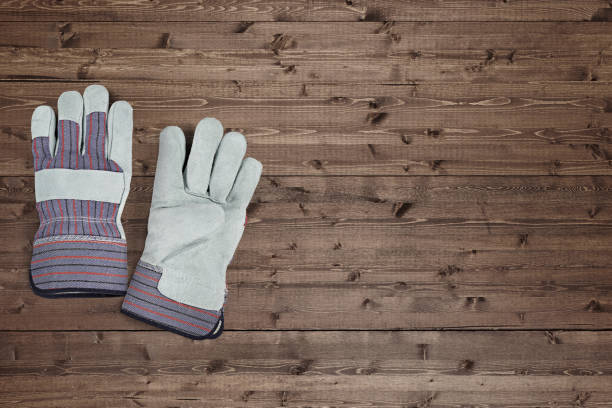 Working or gardening gloves on a wood background