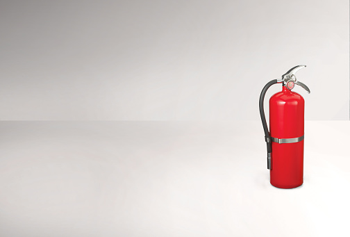 Red fire extinguisher tank on a white background