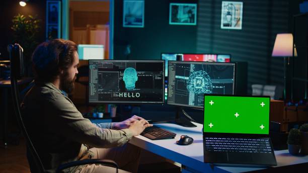 istock Engineer with EEG headset on merging with AI, green screen laptop 2050644257