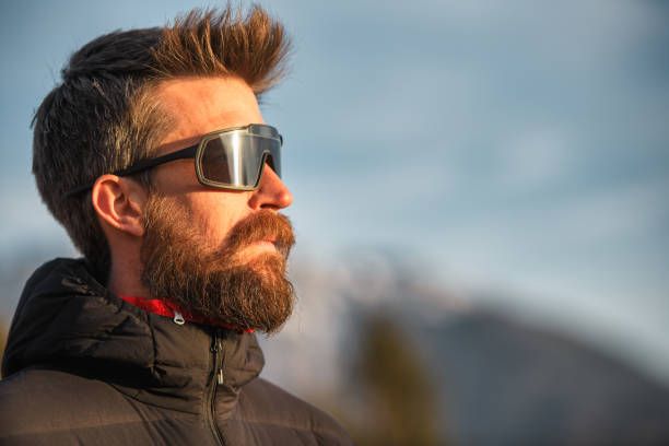 Portrait of young man with beard and sunglasses
