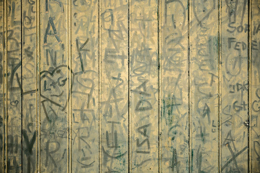 Written plank wall in Orta San Giulio, Italy