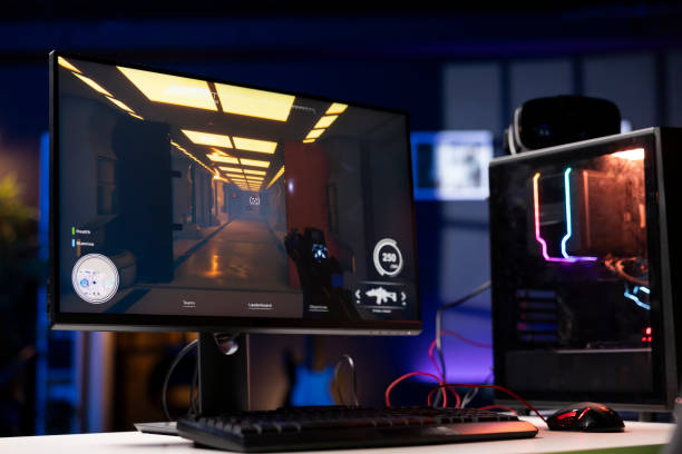 istock FPS videogame left open on PC screen in empty neon illuminated apartment 2050664909