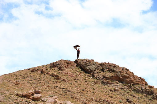 August 27 2023 - Bokonbayevo, Issyk Kul Province in Kyrgyzstan: Kyrgyz Eagle Hunters demonstrate a eagle hunt