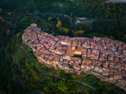 Pitigliano, Italian medieval town from drone at dusk