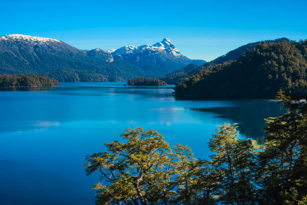 istock Pristine Mountain Lake with Reflective Waters and Lush Forest 2050719950