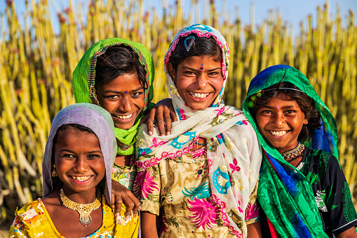 Happy Gypsy Indian children in desert village, Thar Desert, Rajasthan, India.