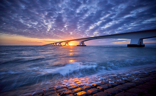 This is a long exposure morning  image of the Newport Bridge from Taylor Point near Jamestown, Rhode Island, USA.