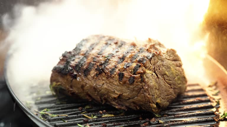 Close up of tenderloin with mustard reduction cooking in a frying pan