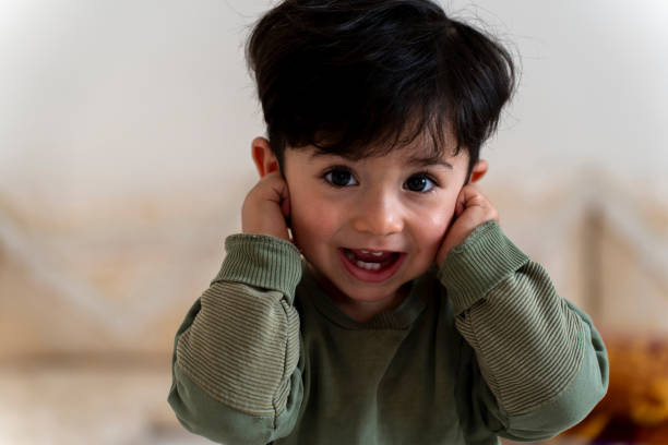 A portrait of a happy baby boy.
