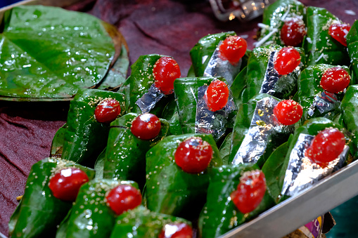 Sweet paan, meetha pan, Betel leaves mouth Freshener, Traditional indian dessert Paan made with Betel leaf and other ingreditients is eaten as a dessert and also aids as a mouth freshner.