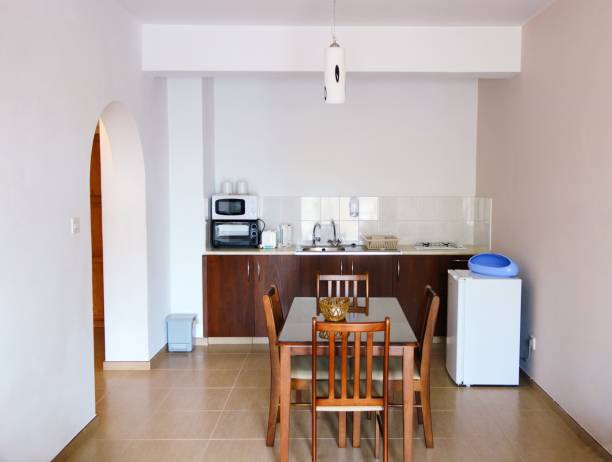 istock A room in an apartment with a kitchen and dining table 2050810482