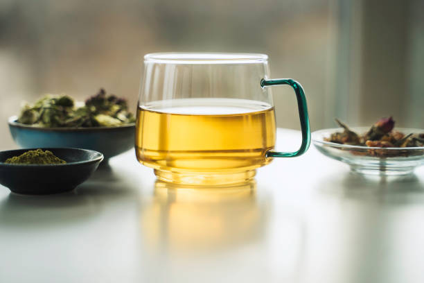 istock A cup of tea with dry fruit, flowers, and herbs. 2050813188