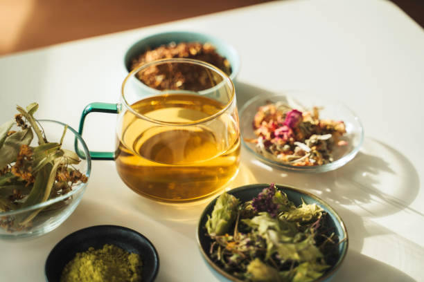 istock A cup of tea with dry fruit, flowers, and herbs. 2050813197