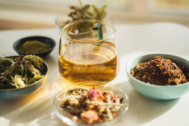 istock A cup of tea with dry fruit, flowers, and herbs. 2050813203