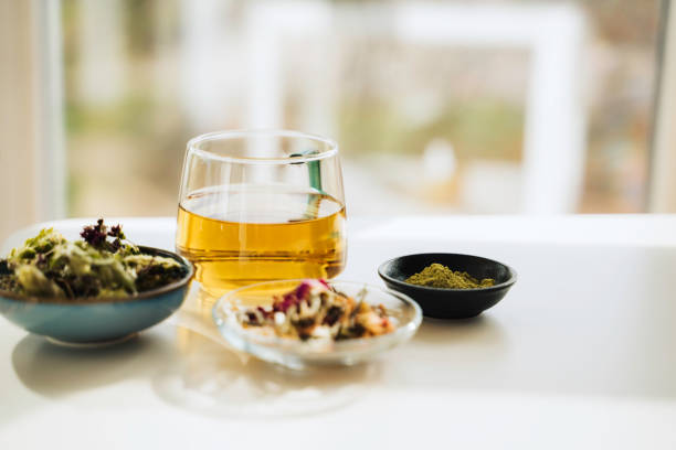 istock A cup of tea with dry fruit, flowers, and herbs. 2050813204