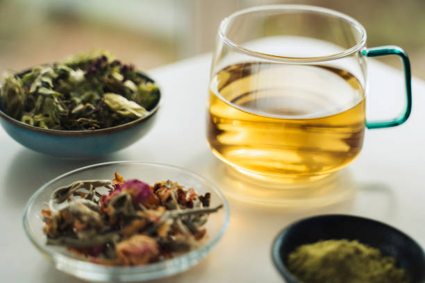 istock A cup of tea with dry fruit, flowers, and herbs. 2050813212