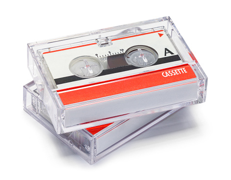 Two Small Audio Cassettes Cut Out on White.