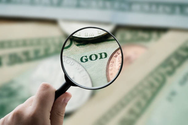 istock Focusing on the God word written on a dollar bill 2050842437