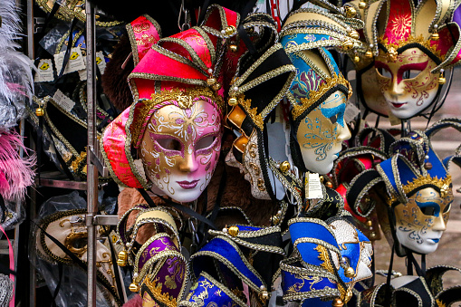 The Carnival of Venice is famed throughout the world for its beautiful and elaborate Venetian masks, here are some displayed on a stall for sale during the festival - Venice, Italy