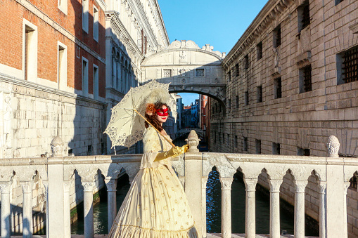 Senior white woman visiting Venice during Covid-19, Italy.