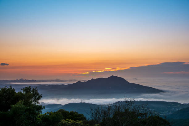 istock The sun, mountains and clouds create a wonderful symphony at dusk. 2050880052