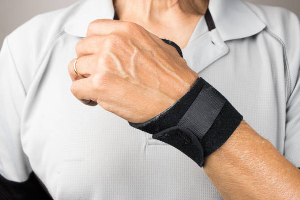 istock Man wearing a wrist brace for pain 2050898959