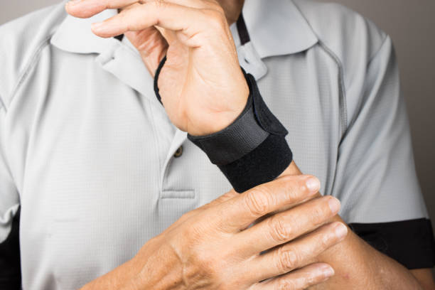 istock Man wearing a wrist brace for pain 2050898963
