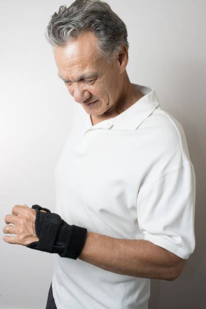 istock Man wearing a brace on his wrist for pain 2050900577