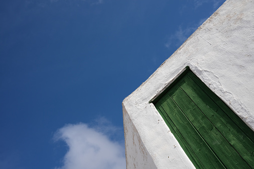 Building exterior makes sharp lines against blue sky in Lanzarote, Canary Islands, Spain