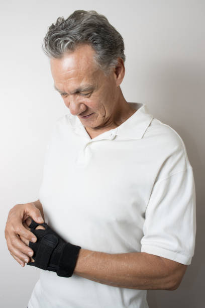 istock Man wearing a brace on his wrist for pain 2050909529