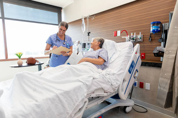 istock Smiling female doctor documents senior woman's medical information 2050951993