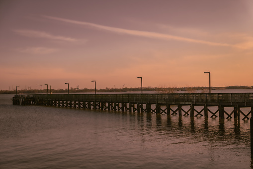 sunset view of a pier near a shipping dock on the delaware river