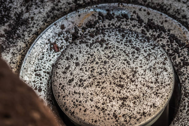 istock Falling dirty particles from a water filter in a white washbasin. Elements of a filtration system for clean and healthy water. Ecology and dirty water 2051004772