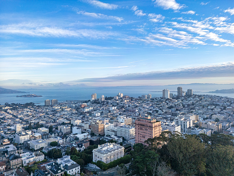 An aerial view above Pacific Heights in San Francisco with the San Francisco Bay and Alcatraz in the distance.