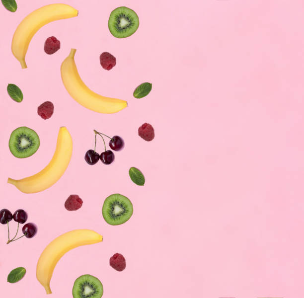 istock Fruit and berry on the pink background. Flat lay. Pattern. Copy space. Top view. 2051051557