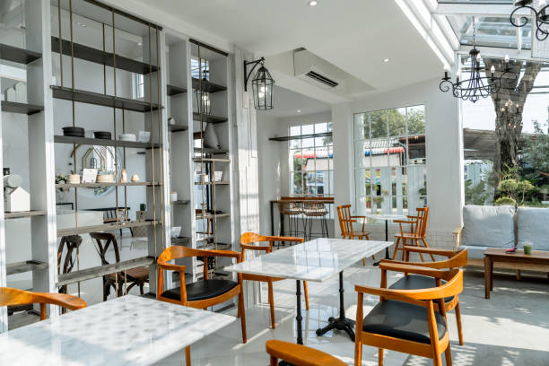Empty Coffee Shop Modern Interior With Wooden Tables in white color