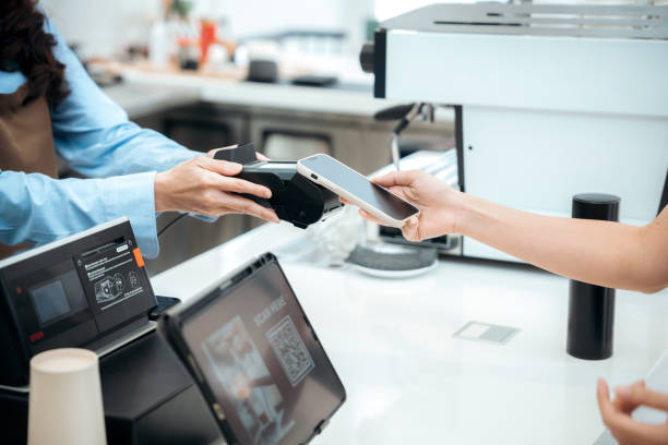 istock Modern Retail Checkout: Customer Using Smartphone for Contactless Payment at Register 2051056234