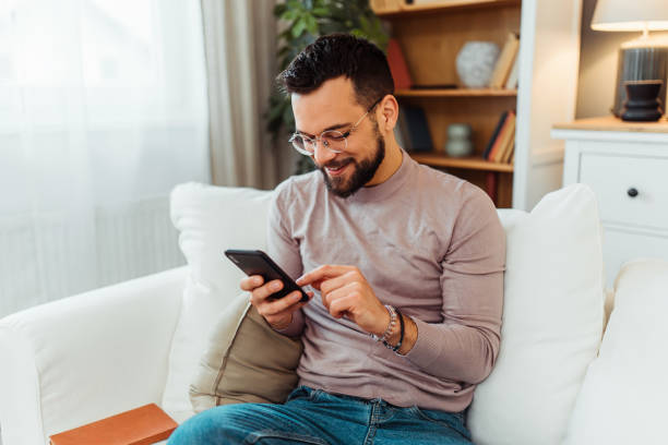 istock Handsome man relaxing in his home 2051061956