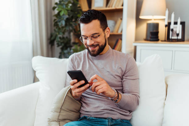 istock Handsome man relaxing in his home 2051061958