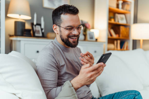 istock Handsome man enjoying in a free time in his home 2051063537