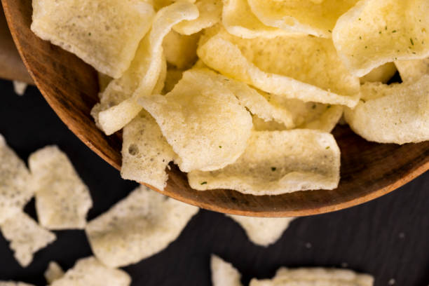 istock crispy potato chips with spices on the table 2051074498